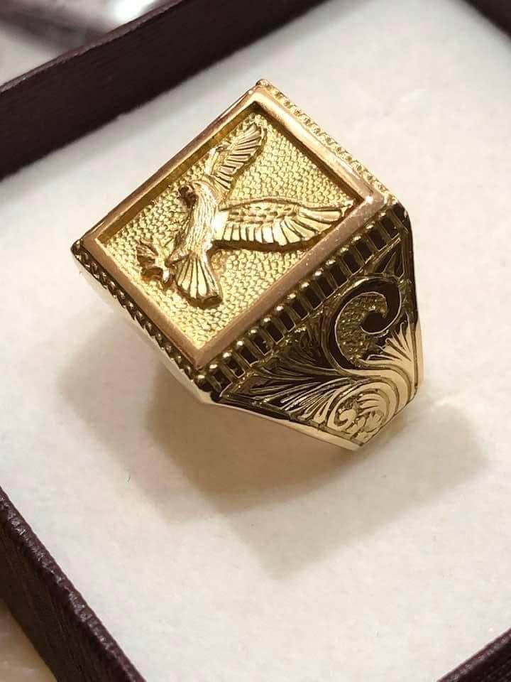 Custom hand-engraved gold eagle signet ring
